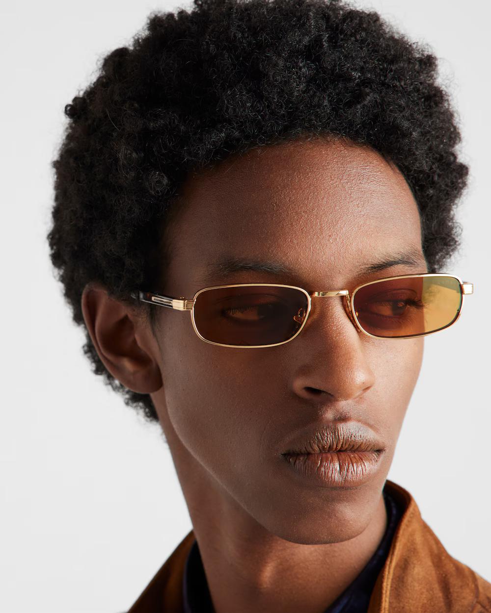 Sunglasses with the iconic metal plaque